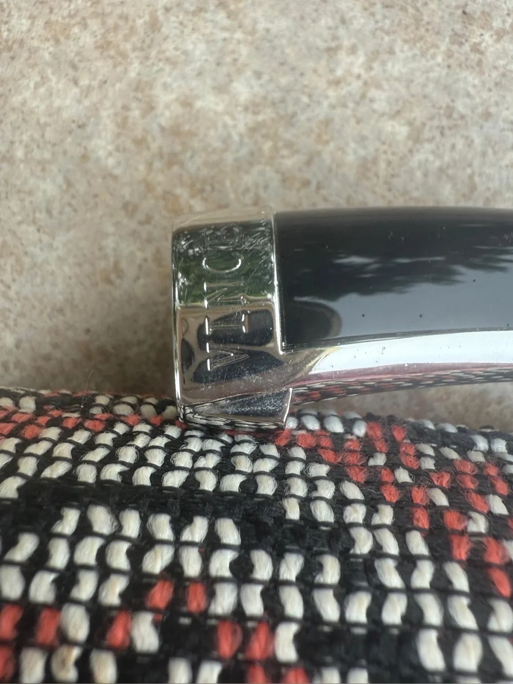 Vince Camuto textured clutch bag with a crossbody chain